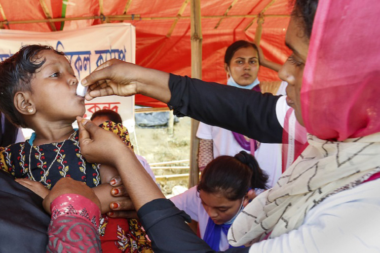 NGO workers provide free health care services, Bangladesh.