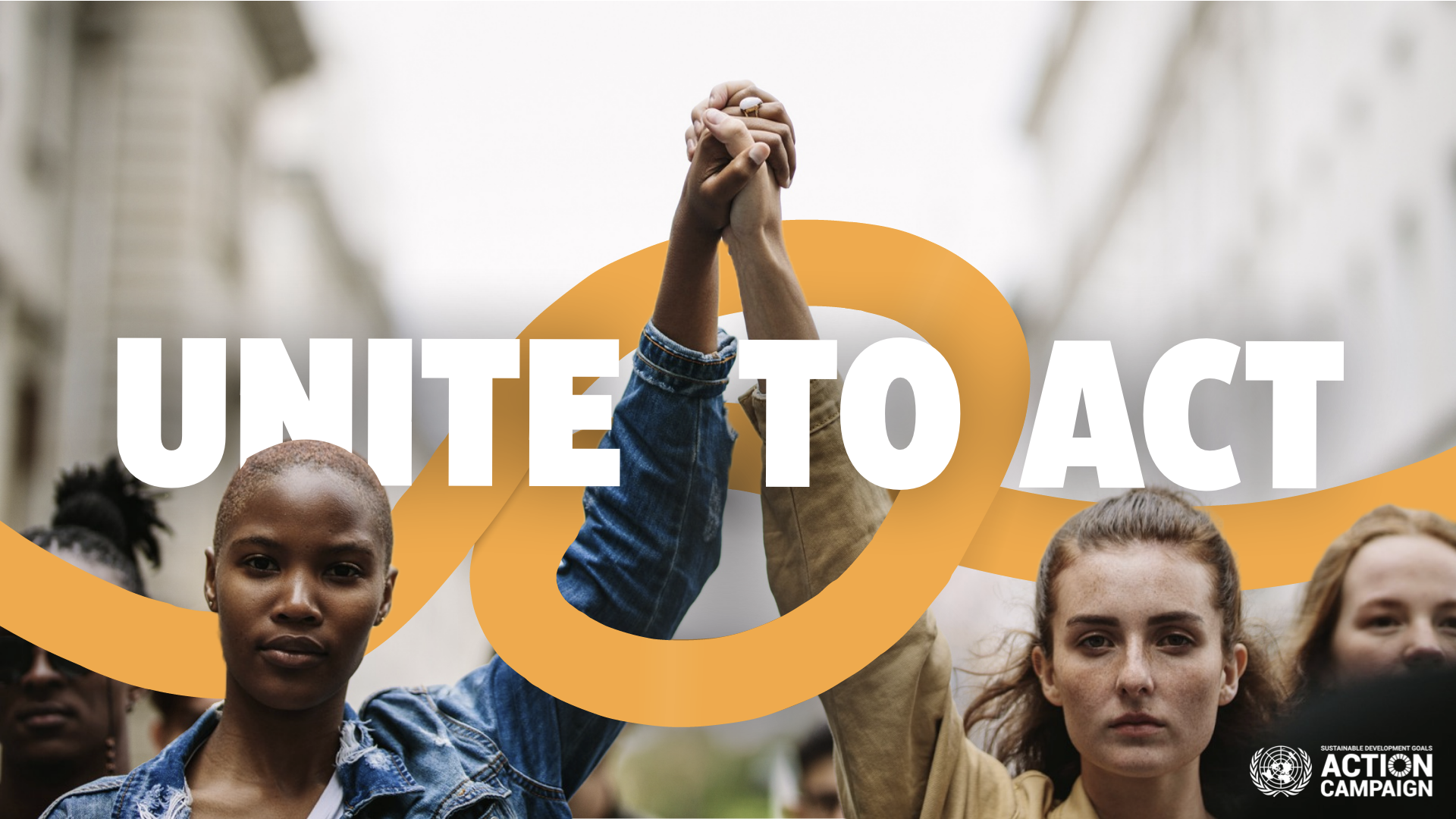 two women hold hands while holding them up with a line connecting them along the words: Unite to Act