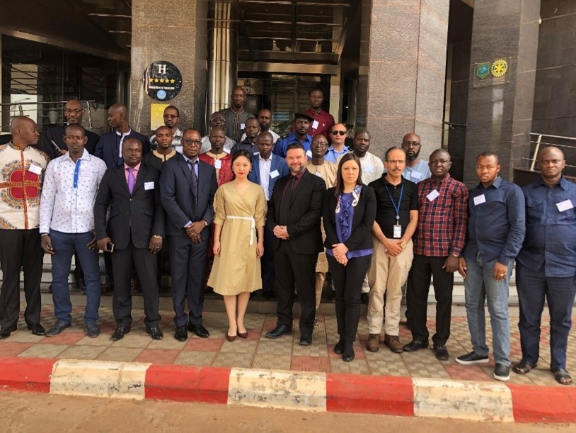 Group photo on the street outside a building