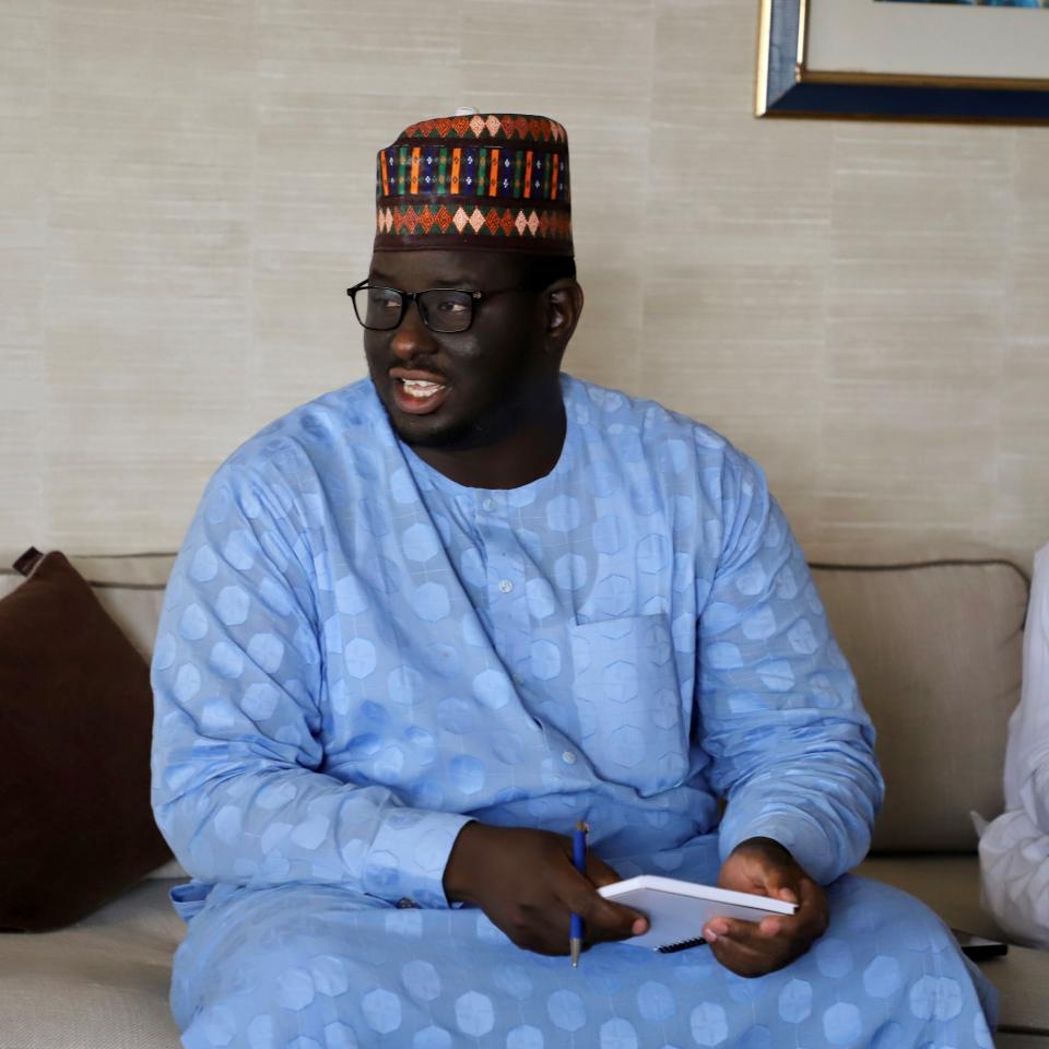 seated on a chouch and conversing