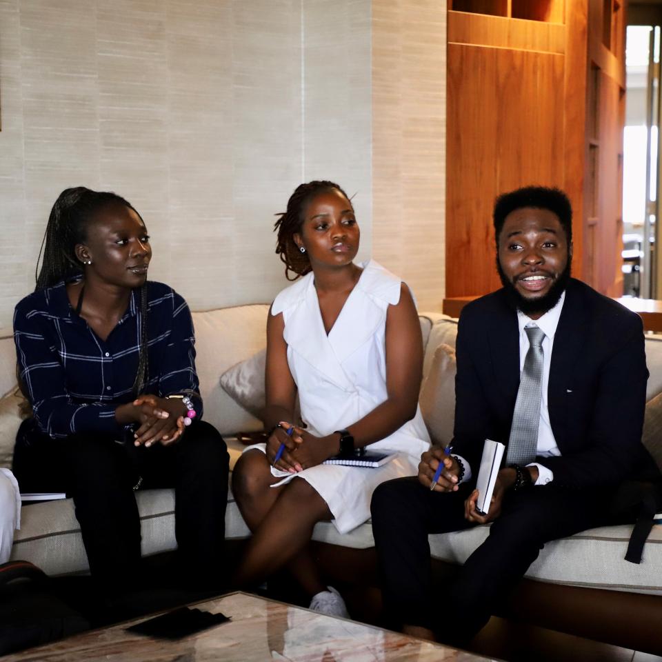 seated on a chouch and conversing