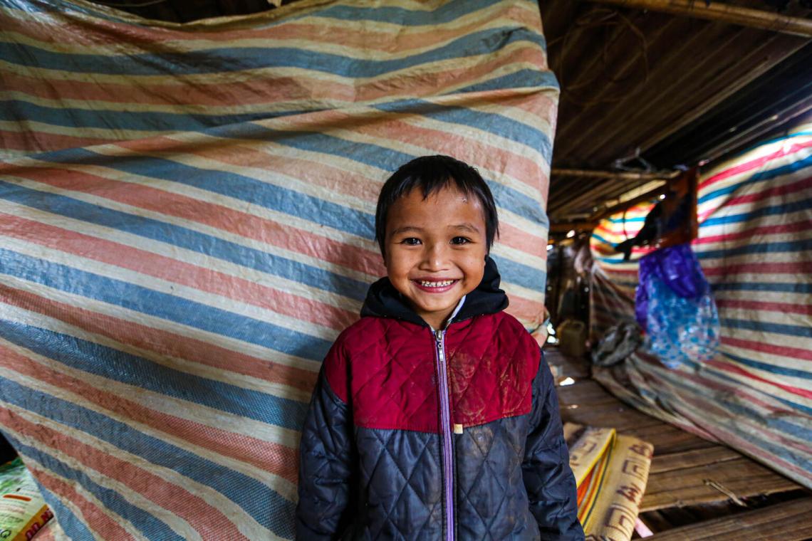 little girl in shelter, smiling