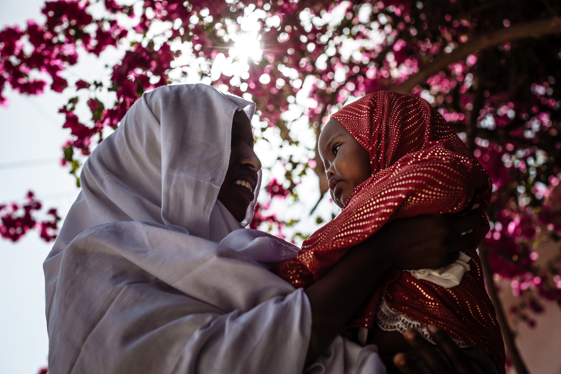 Fadmou holding her daughter