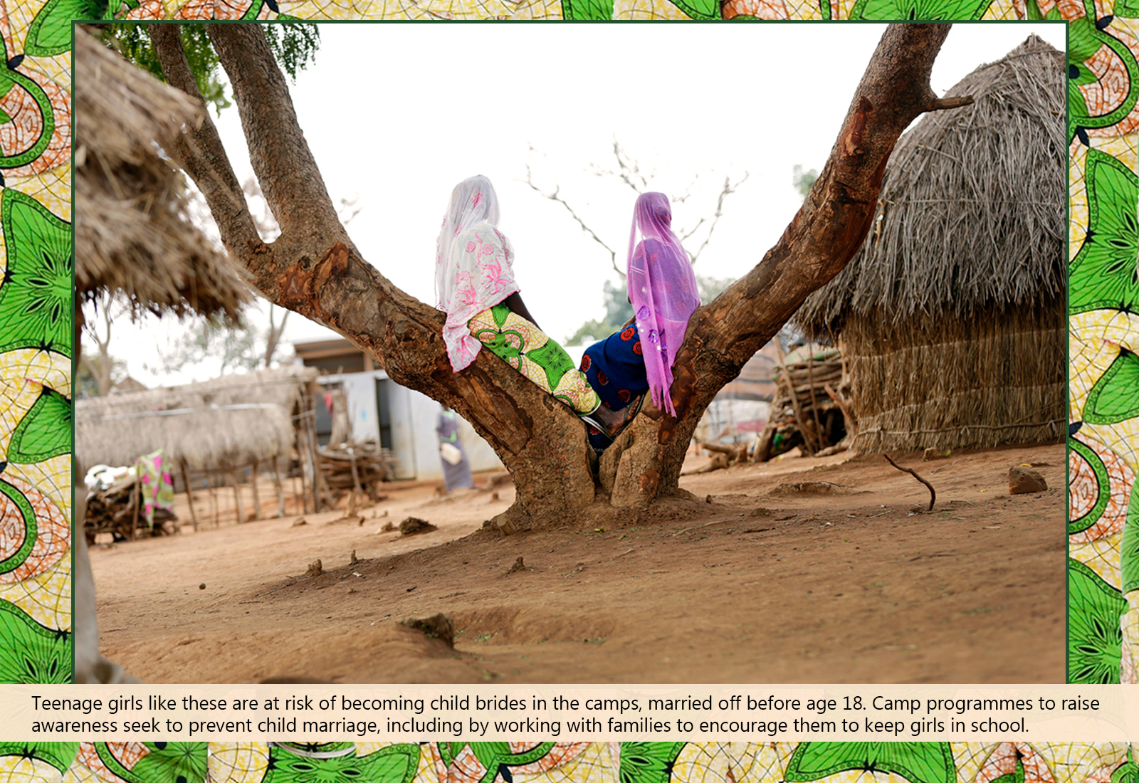 Two teenage girls seating on a tree