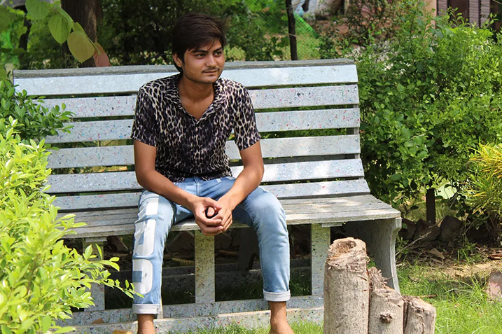 man sitting on a bench outdoors