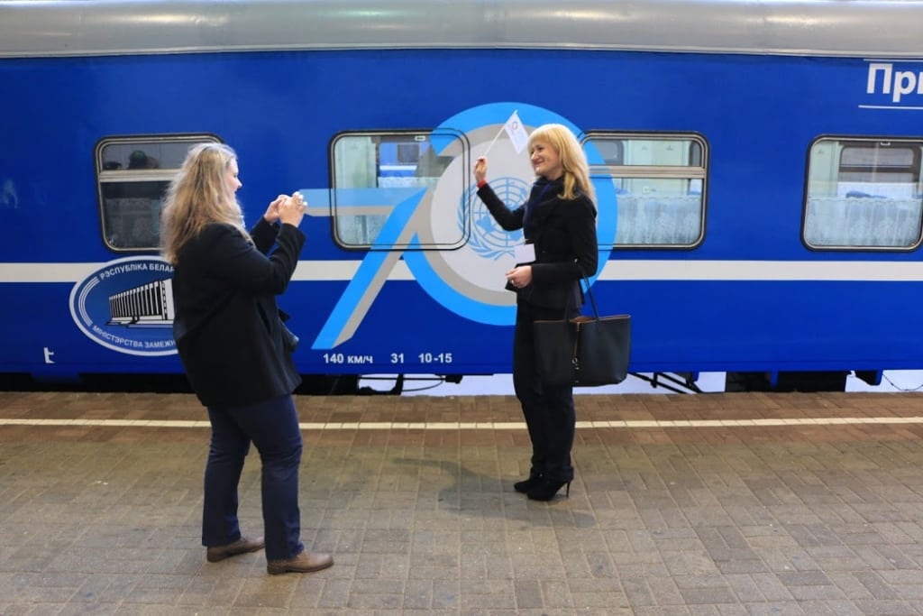 People take photos outside the UN70 Belarus Express in Minsk.