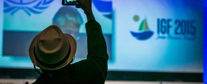 Photo: A man takes a photo on the first day of the Internet Governance Forum in Joao Pessoa, Brazil.