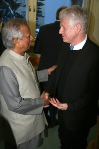 Photo: Advocates Muhammad Yunus and Richard Curtis have a discussion in Davos.