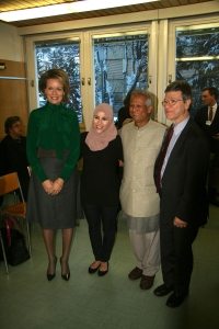 Photo: SDG Advocates Queen Mathilde of Belgium, Alaa Murabit, Muhammad Yunus and Jeffrey Sachs pose for a photo in Davos.