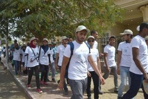 Participants at an SDG event in Aswan, Egypt, wear SDG T-shirts.