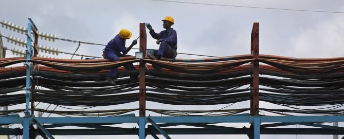 Photo: Workers maintain the thermal power station at Takoradi, Ghana. (Photo by World Bank/Jonathan Ernst)