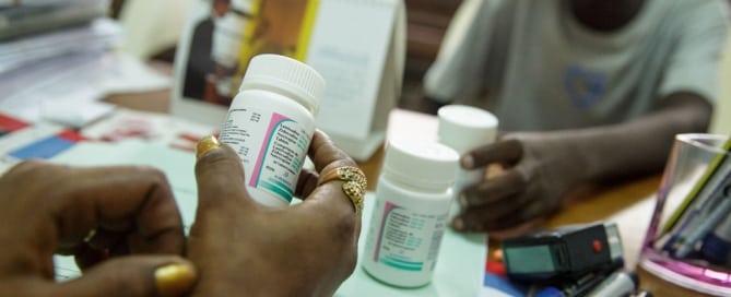 Photo: In Côte d’Ivoire, a counsellor from UNICEF partner NGO Femme Active, instructs an adolescent boy, diagnosed with HIV in 2012, on how to take his antiretroviral (ARV) medication correctly. Photo: UNICEF/Olivier Asselin