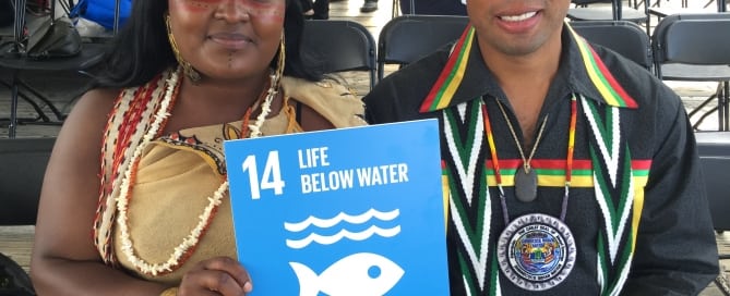 Photo: Chenae Bullock and Bryan Polite of the Shinnecock Nation in NY pose with Goal 14 at the Hokule'a event.