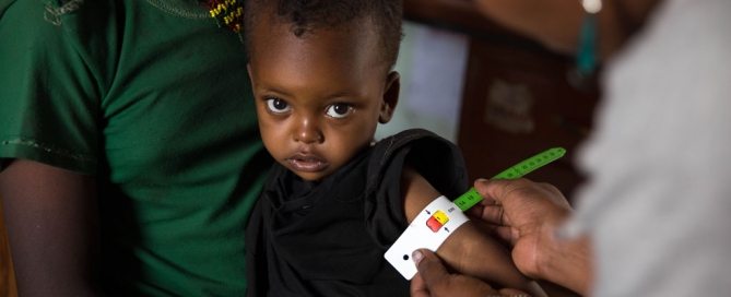 Photo: At the Gedebe Health Post in Halaba Special Woreda (district) in SNNP Region of Ethiopia, 28-month-old Nebila has her mid-upper-arm circumference measured by a health worker. She was diagnosed with severe acute malnutrition and has been receiving treatment including ready-to-use-therapeutic food (RUTF). Photo: UNICEF/UN022074/Ayene