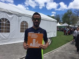 Photo: A Habitat 3 attendee from Caracas shows support for Goal 11.