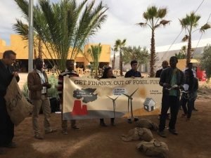 Photo: Activists protest fossil fuels on civil action day at COP22.