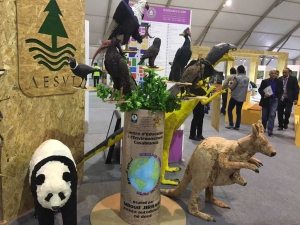 Photo: One exhibitor gets crafty making animals out of recycled paper.