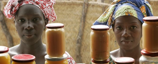 Photo: Women sell mango and sweet potato jam at the food processing shop in Bantantinnting, Senegal.