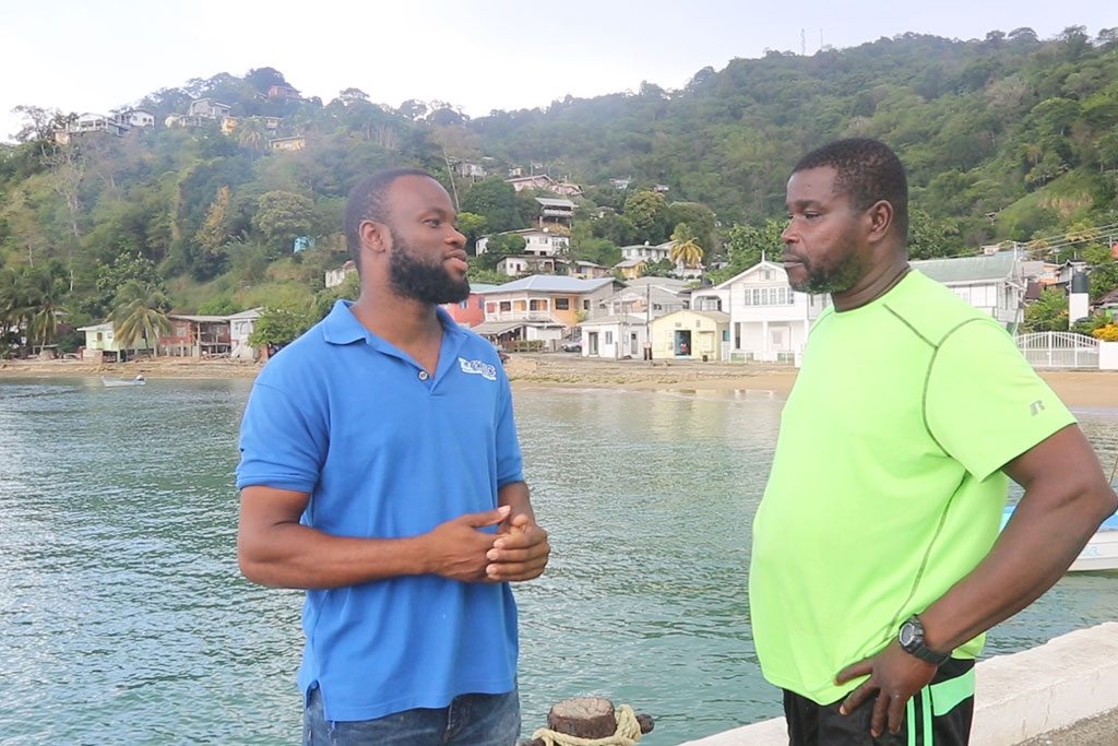 Fisherman Welldon Mapp (left) has been working with the Environmental Research Institute Charlotteville (ERIC) in its three years of operation. The group supports communities in north-eastern Tobago to co-manage natural resources, including reefs. Mr. Mapp, 25, also engages with people in his hometown, Charlotteville, to get them to think about issues that have an impact on the natural environment such as climate change and overfishing. Photo: UN News/Lulu Gao