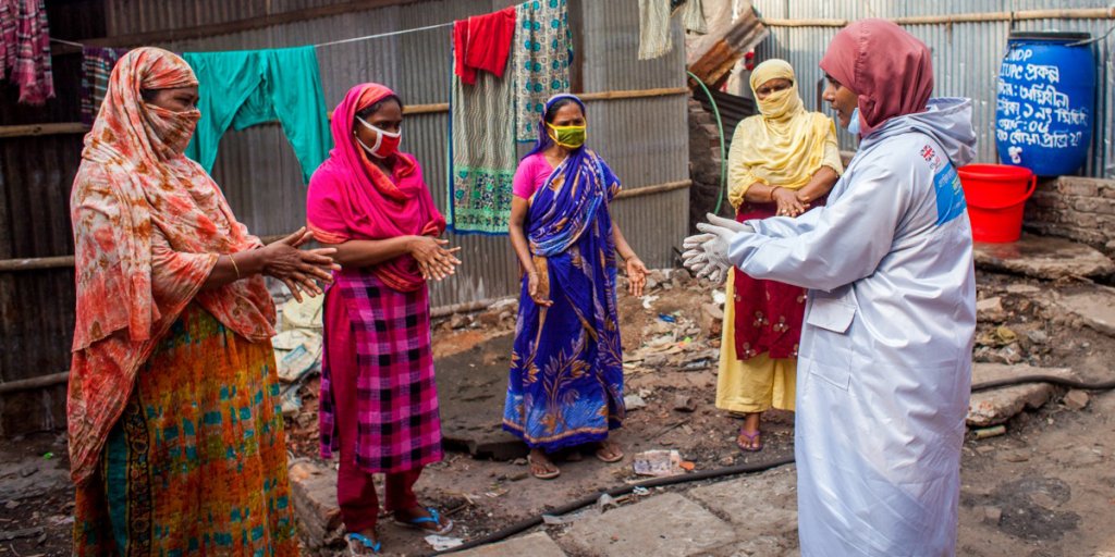 Women in Bangladesh being taught how to sanitize their hands