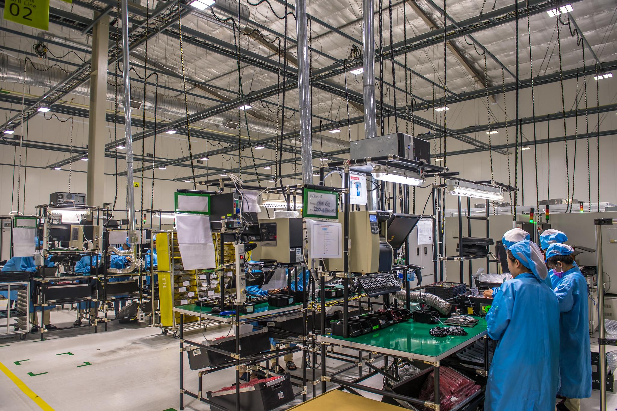 Technicians and workers assemble electronic products in one of the factories in Savannakhet, Lao PDR. The growth of industry and cross-border trade are bringing jobs to the area. 