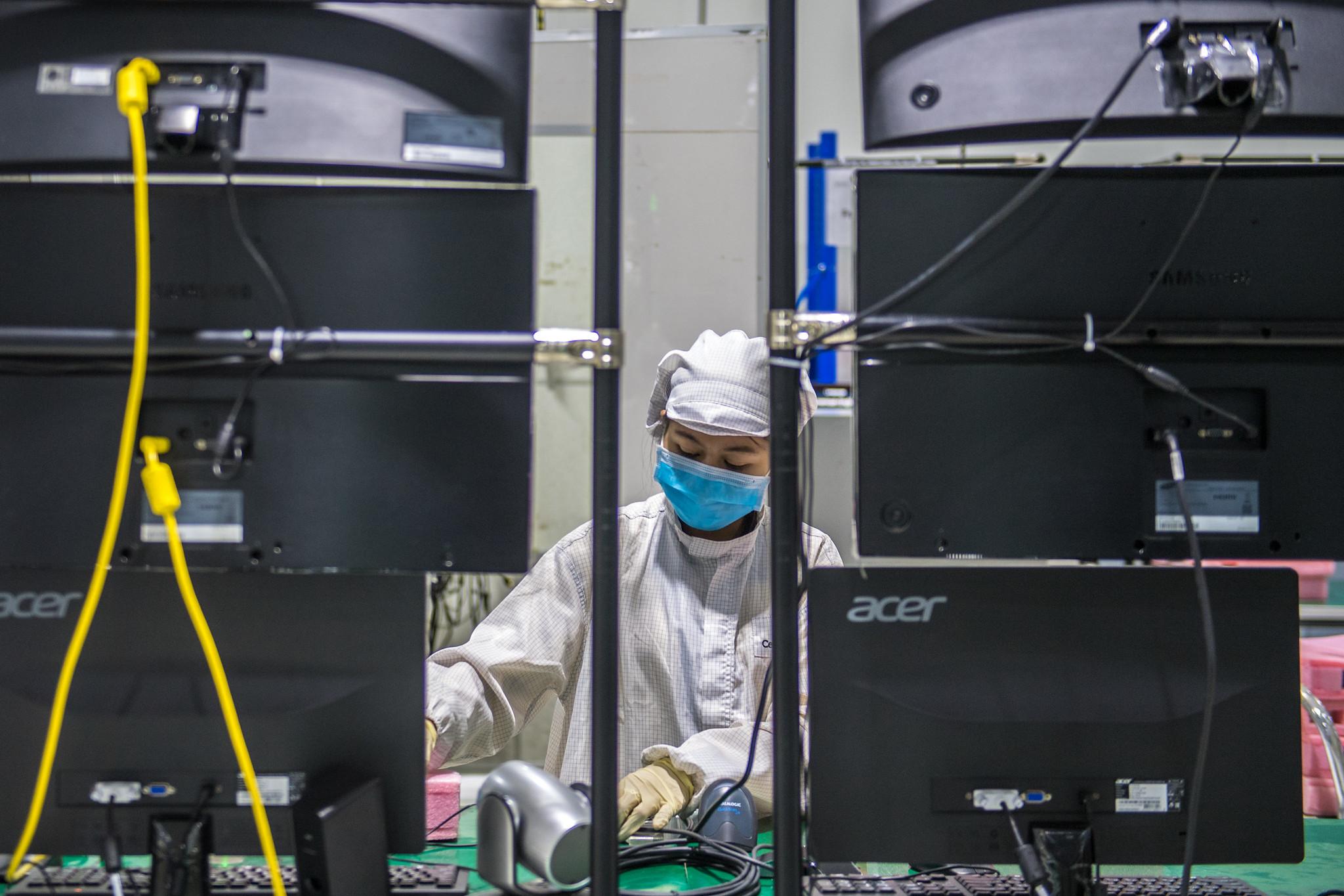 A technician assembles electronic products in Savannakhet, Lao PDR.