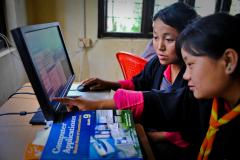 Students practice computer exercises at the community e-Center in Bhutan.