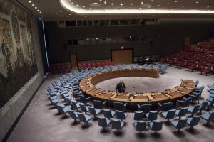 A Conference Officer at work in the Security Council Chamber, ahead of a Council meeting. UN Photo/Kim Haughton