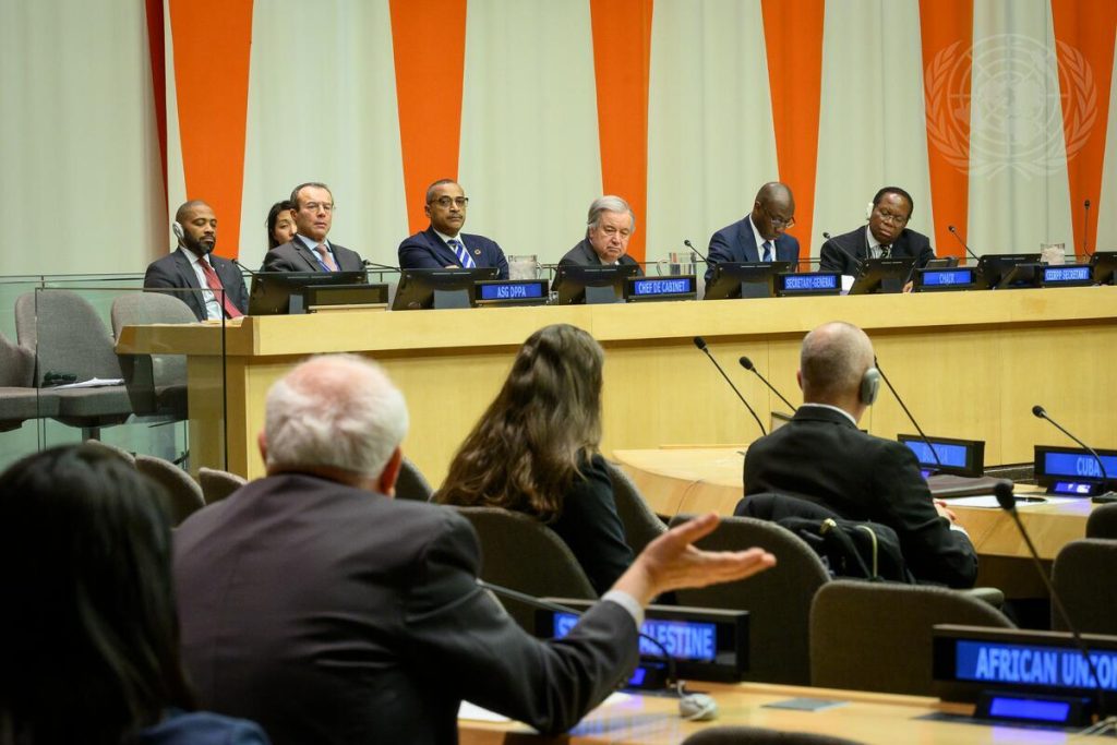 Riyad Mansour (in foreground with back to camera), Permanent Observer of the State of Palestine to the United Nations, speaks during the 2025 opening session and the 420th meeting of the Committee on the Exercise of the Inalienable Rights of the Palestinian People. In background at dais is Secretary-General António Guterres (third from right).