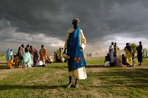 women and approaching storm