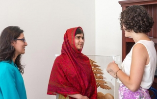Malala Yousafzai (centre) with Olivia Curl (left) and Lena Shareef, creators of #GirlWithABook. UN Photo/Mark Garten