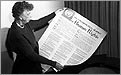 Eleanor Roosevelt holds a poster of the Universal Declaration of Human Rights